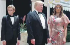  ?? — Reuters ?? President Donald Trump and first lady Melania Trump, with their son Barron, arrive for a New Year’s Eve party at his Mar-a-Lago club in Palm Beach, Florida.