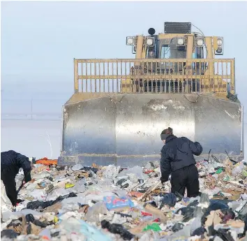  ??  ?? Members of the Regina Police Service search the landfill for the body of Jaroslav ‘Joe’ Heindl on Jan. 3, 2003.