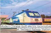  ??  ?? Modern Chinese-built electric locomotive at Tashkent Railway Station.