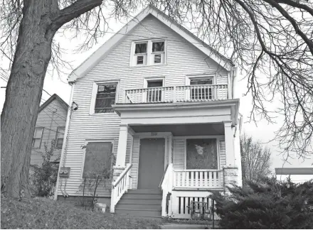  ?? RICK WOOD / MILWAUKEE JOURNAL SENTINEL ?? Elijah Mohammad Rashaed is linked to a dizzying array of companies created to run nearly 200 rental properties and business interests. One company, Second Property Developmen­t LLC, owns this duplex in the 2000 block of W. Hopkins St. that has racked up building code violations.