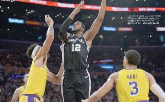  ?? — USA Today Sports ?? San Antonio Spurs’ Lamarcus Aldridge (12) moves to the basket against Los Angeles Lakers’ Javale Mcgee (7) at Staples Center.