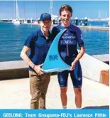  ?? — AFP ?? GEELONG: Team Groupama-FDJ’s Laurence Pithie of New Zealand (R) poses with Cadel Evans and the trophy for winning the 2024 Men’s Elite Cadel Evans Great Ocean Road Race cycling event in Geelong on January 28, 2024.