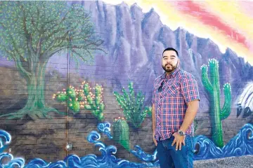  ?? — WP-Bloomberg photos ?? Rodriquez, 24, stands for a photograph at Mesa Community College in Mesa, Arizona, on Feb 21.