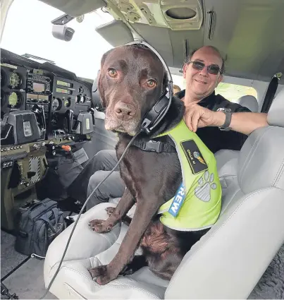  ?? Pictures: Phil Hannah. ?? Callie in the cockpit with her owner, pilot Graham Mountford.