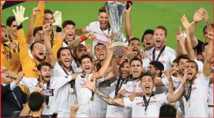  ??  ?? Sevilla players celebratin­g their Europa League final victory over Inter Milan of Italy in Cologne, Germany
