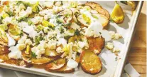  ?? TOM MCCORKLE/THE WASHINGTON POST ?? Greek-ish nachos made with potatoes are a delicious party snack, but will also work well as a dinner side.