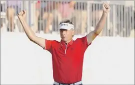  ?? Daniel Sangjib Min Associated Press ?? BERNHARD LANGER, 64, celebrates making a birdie putt on the first playoff hole to win the Dominion Energy Charity Classic over Doug Barron.