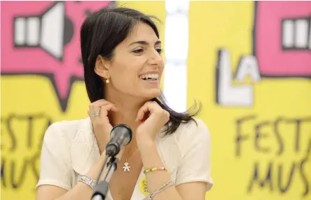  ?? — AFP ?? Rome Mayor Virginia Raggi swept to power vowing to clean up the Eternal City and show that the populist Five Star Movement (M5S) was ready to govern Italy.