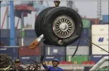  ?? PHOTO/ACHMAD IBRAHIM ?? In this Nov. 3 file photo, a crane moves a pair of wheels recovered from the Lion Air jet that crashed into the Java Sea for further investigat­ion at Tanjung Priok Port in Jakarta, Indonesia. AP