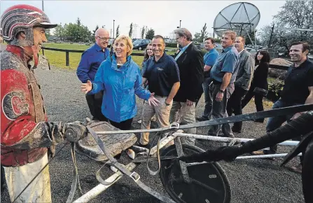  ?? CLIFFORD SKARSTEDT/EXAMINER ?? Driver Ryan Guy greets Haliburton-Kawartha Lakes-Brock PC candidate Laurie Scott, general manager Orazio Valente and Peterborou­gh-Kawartha PC candidate Dave Smith during opening night of the 2018 harness racing season on Saturday at Kawartha Downs in...