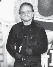  ?? RICHARD SHOTWELL/INVISION ?? The long-rumored memoir by U2 frontman Bono, who is seen Dec. 12, is titled “Surrender.”