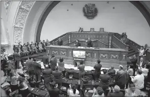  ?? AP/ARIANA CUBILLOS ?? Some foreign diplomats (left) receive applause Saturday for their show of solidarity with Venezuelan lawmakers during a special session of Venezuela’s National Assembly in Caracas.