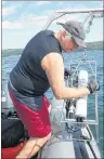  ?? SUBMITTED PHOTO ?? Bruce Hatcher deploys research equipment into the Bras d’Or Lake.