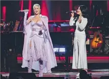  ??  ?? KATY PERRY, left, and Kacey Musgraves perform at the preGrammys tribute to Dolly Parton at the L.A. Convention Center.