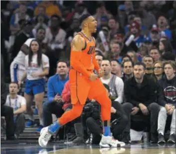  ?? MICHAEL PEREZ — THE ASSOCIATED PRESS ?? Oklahoma City’s Russell Westbrook celebrates at the end of a play in the second half Saturday. The closing ability of Westbrook and Paul George led the Thunder to a 117-115 win over the Sixers, offering the hosts a glimpse of what it takes to be among the NBA’s elite teams.