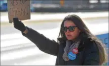  ?? PETE BANNAN — DIGITAL FIRST MEDIA ?? A woman from Oreland, Montgomery County, protests outside Congressma­n Pat Meehan’s Springfiel­d office Thursday.