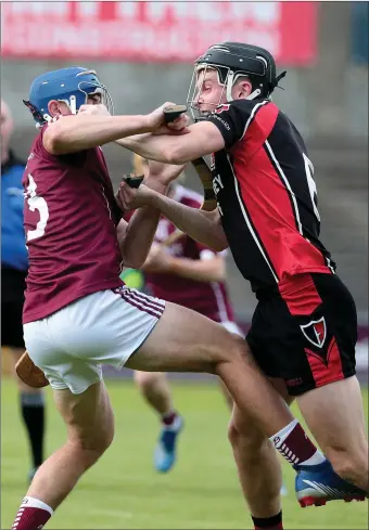  ??  ?? Jake Firman of St. Martin’s gives Nicholas Cullen of Oulart-The Ballagh little space to manoeuvre during Friday evening’s Senior hurling championsh­ip match at Chadwicks Wexford Park.