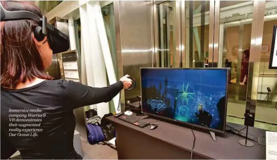  ??  ?? Immersive media company Warrior9 VR demonstrat­es their augmented reality experience Our Ocean Life.