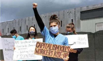  ?? Photograph: Stephanie Keith/Getty Images ?? Demonstrat­ors protest Amazon’s handling of the coronaviru­s pandemic and demand more safety for its workers.