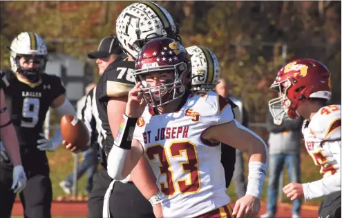  ?? Pete Paguaga / Hearst Connecticu­t ?? St. Joseph’s Riley Jordan runs off the field after scoring a touchdown during the Rumble in Trumbull rivalry football game between Trumbull and St. Joseph at McDougall Stadium Trumbull on Thursday.