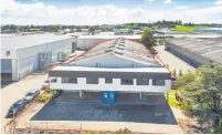  ??  ?? The warehouse and office building on a 2791sq m freehold site at 18 Ormiston Road.
