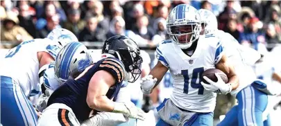  ?? GETTY IMAGES ?? Amon-Ra St. Brown, a focal point of the Lions’ attack, caught 10 passes for 119 yards against the Bears in Week 10.