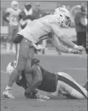  ?? LYNNE SLADKY, THE ASSOCIATED PRESS ?? Ryan Tannehill was injured on this tackle by Arizona Cardinals Calais Campbell.