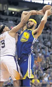  ?? RICK SCUTERI — THE ASSOCIATED PRESS ?? Warriors center JaVale McGee was 5 of 6 from the field and scored 11 points in Sunday night’s win over the Suns.