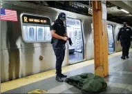  ?? ?? New York anti-terror police inspect a discarded coat