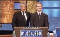  ?? Jeopardy Production­s / TNS ?? “Jeopardy!” host Alex Trebek, left, with contestant Ken Jennings after his earnings from his record-breaking streak on the game show surpassed $1 million, on July 14, 2004.