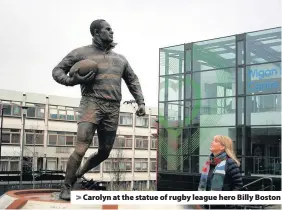  ??  ?? > Carolyn at the statue of rugby league hero Billy Boston