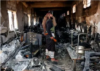  ?? ?? n this picture taken Tuesday, Jan. 2, 2016, a man examines damage at the National Museum in the war-torn city of Taiz, Yemen. Abdulnasse­r Alseddik/ASSOCIATED PRESS