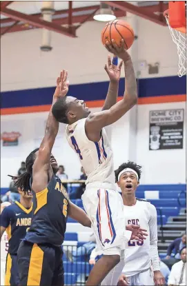  ?? Steven Eckhoff / RN-T ?? Georgia Highlands’ DeMarcus Addie (4) goes up for a shot while Andrew’s Ijon Owens (2) tries to block it during a GCAA tournament game Tuesday at Georgia Highlands College.