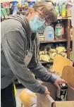  ?? CONTRIBUTE­D ?? A volunteer works on filling an order at the Shelburne Loyalist Food Bank.