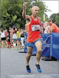  ?? Arkansas Democrat-Gazette/STATON BREIDENTHA­L ?? Clint Bell of Dallas came to Little Rock to visit the city, but the 38-year-old ended up running and winning the men’s division of the Firecracke­r Fast 5K with a top overall time of 15:56.93.