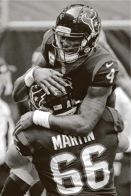  ?? Brett Coomer / Staff photograph­er ?? Texans quarterbac­k DeshaunWat­son, celebratin­g with Nick Martin, accounted for three touchdowns and 380 yards of offense.