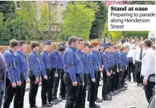  ??  ?? Stand at ease Preparing to parade along Henderson Street