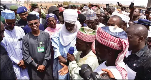  ??  ?? A community leader briefing Governor Nasir El-Rufai during his visit to one of the affected communitie­s where 51 people were killed