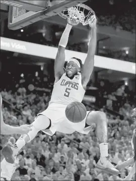  ?? Ben Margot Associated Press ?? THE CLIPPERS’ Montrezl Harrell dunks for two of his 24 points in Wednesday’s Game 5 victory over the Warriors. The reserve also had f ive rebounds.