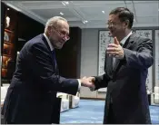  ?? ALY SONG/POOL PHOTO VIA AP ?? U.S. Senate Majority Leader Chuck Schumer is greeted by Shanghai’s Communist Party Secretary Chen Jining on Saturday upon the American lawmakers’ arrival in China.