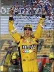  ?? RICK SCUTERI — THE ASSOCIATED PRESS ?? Kyle Busch (18) celebrates after winning a NASCAR Cup Series auto race on Sunday in Avondale, Ariz.