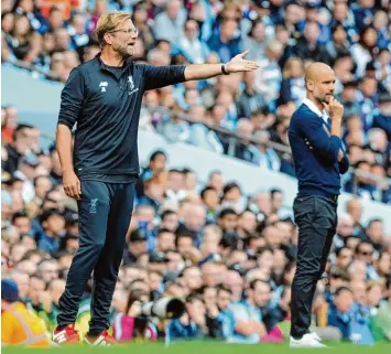  ?? Foto: Rui Vieira, dpa ?? Mit dem FC Liverpool erlebte Jürgen Klopp (links) seine höchste Niederlage als Trainer in England. Vorgeführt wurde seine Mann schaft von Manchester City und dessen spanischem Startraine­r Pep Guardiola.