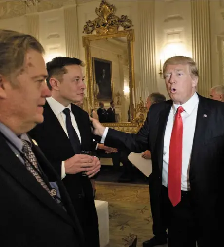  ??  ?? HUGE RICHES: US President Donald Trump greets multi-billionair­e Elon Musk with former advisor Steve Bannon