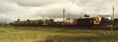  ??  ?? 20148, with snowplough­s, leads a trip working into Fort William on 9th June 1983.