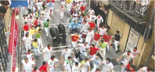  ?? RICK STEVES/ RICK STEVES’ EUROPE ?? The Running of the Bulls takes place every summer during Pamplona's Festival of San Fermín. It's organized mayhem that is over in 131 seconds.