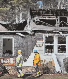  ??  ?? TOTAL LOSS: Elaine Buote’s Dracut home, above, is a total loss after a four-alarm fire yesterday, but the family plans to rebuild. STAFF PHOTO BY PATRICK WHITTEMORE