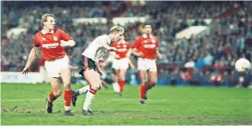  ?? DICK WILLIAMS/ALBERT COOPER/MIRRORPIX/GETTY IMAGES ?? ▲ Mark Robins, under pressure from Stuart Pearce, scores the winner in 1990