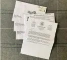  ??  ?? Two absentee ballot envelopes, one warning letter from the BOE and an unusable return envelope and ballot envelope addressed to someone else Photograph: Amanda Holpuch