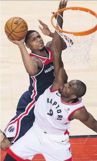  ?? NATHAN DENETTE/THE CANADIAN PRESS ?? Toronto Raptors forward Serge Ibaka, pictured defending Washington’s Bradley Beal in Game 1 of their playoff series, has become an integral part of the Raptors’ success story this season, and recorded a team-high 23 points in their opening game victory...