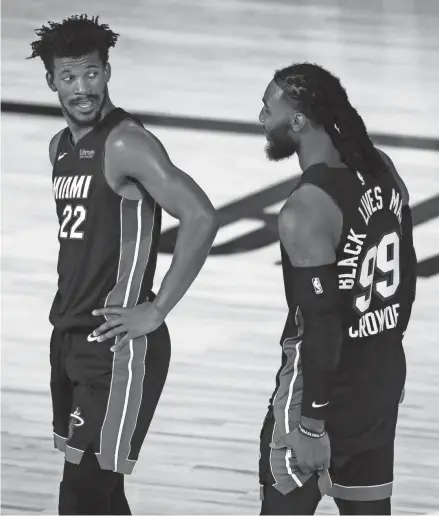  ?? GETTY IMAGES ?? Former Marquette stars Jimmy Butler and Jae Crowder have helped Miami take a 2-0 lead over the Bucks.